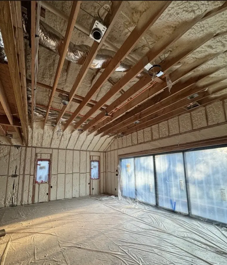 Interior walls and ceiling insulated with spray foam during new construction in Haslet